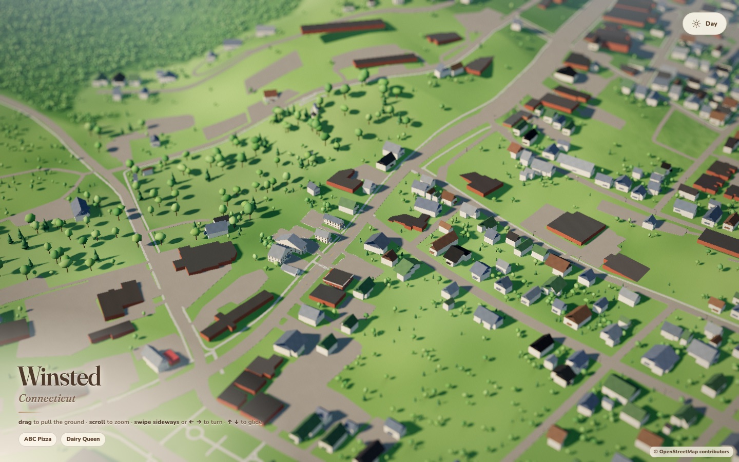 An aerial view of Winsted in Miniature with terrain, streets, buildings, trees, and Highland Lake.